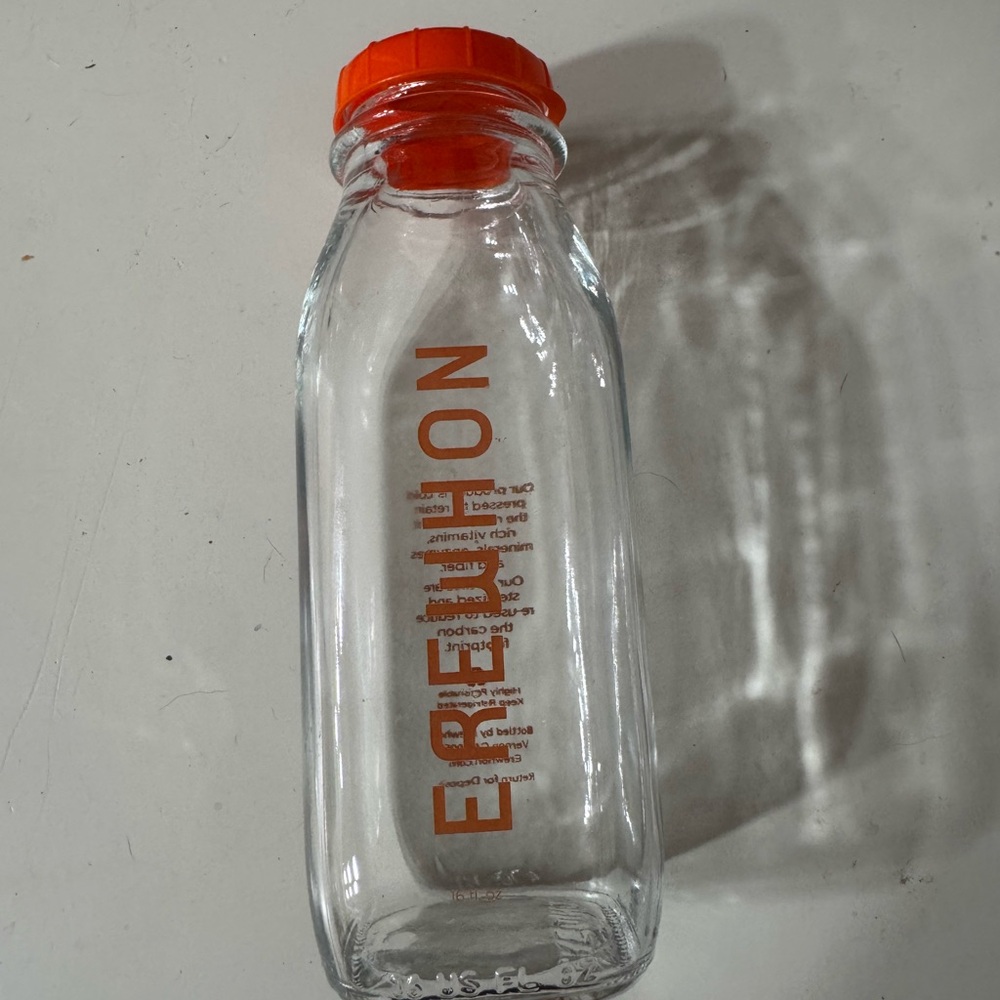 Erewhon Clear Glass Bottle with Orange Cap